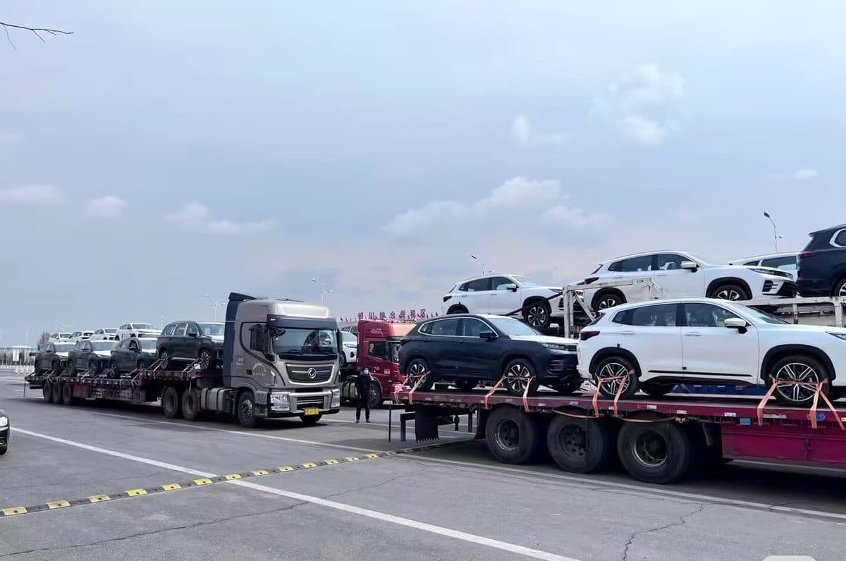 Car-carrier trucks moving export vehicles to the port
